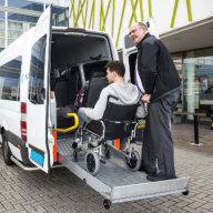 man assisting old man